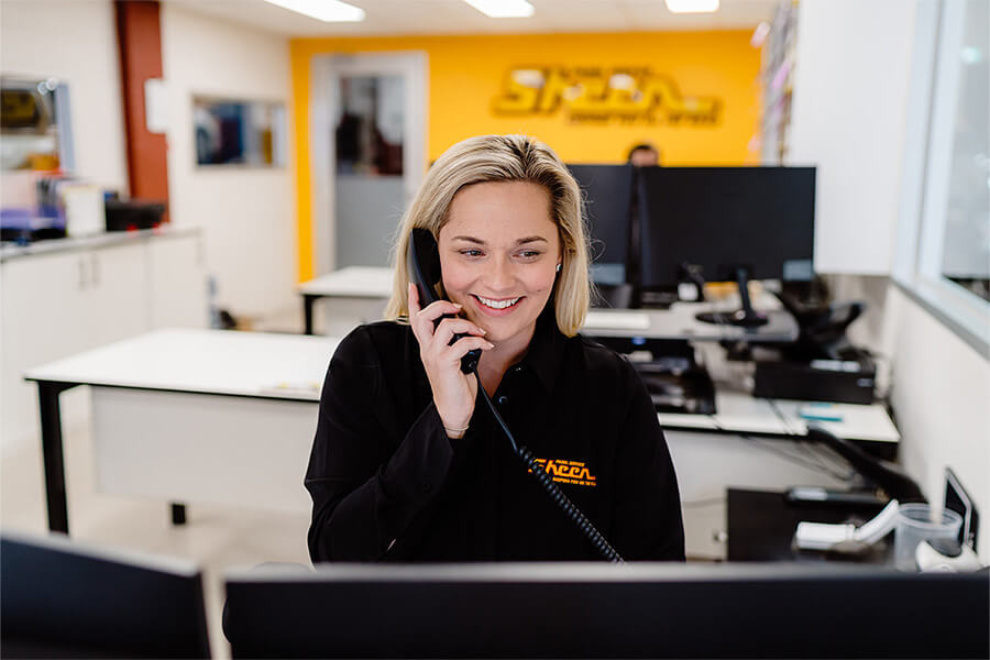 mage of Sheen Panel Services reception area with smiling, friendly receptionist.