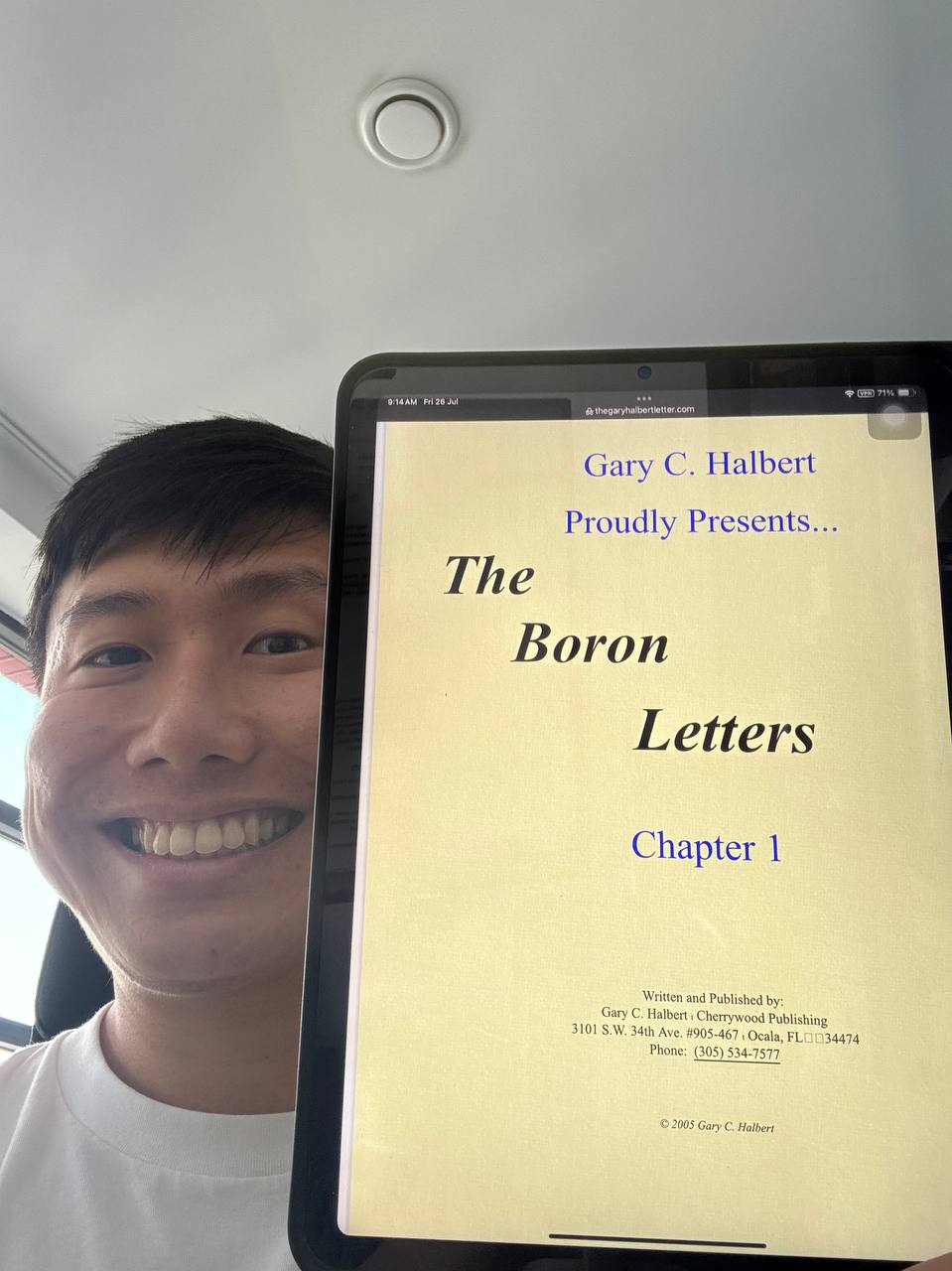 Si Quan holding the book Boron Letters